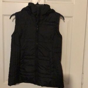 Black puffy vest with hood. Never worn